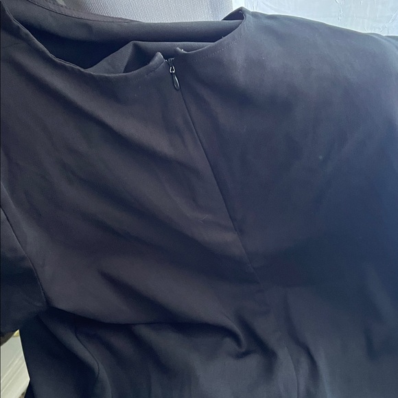 2 dresses. Black Polka Dot Tiered Dress & Solid Black Ruffle Hem Dress - Picture 5 of 7